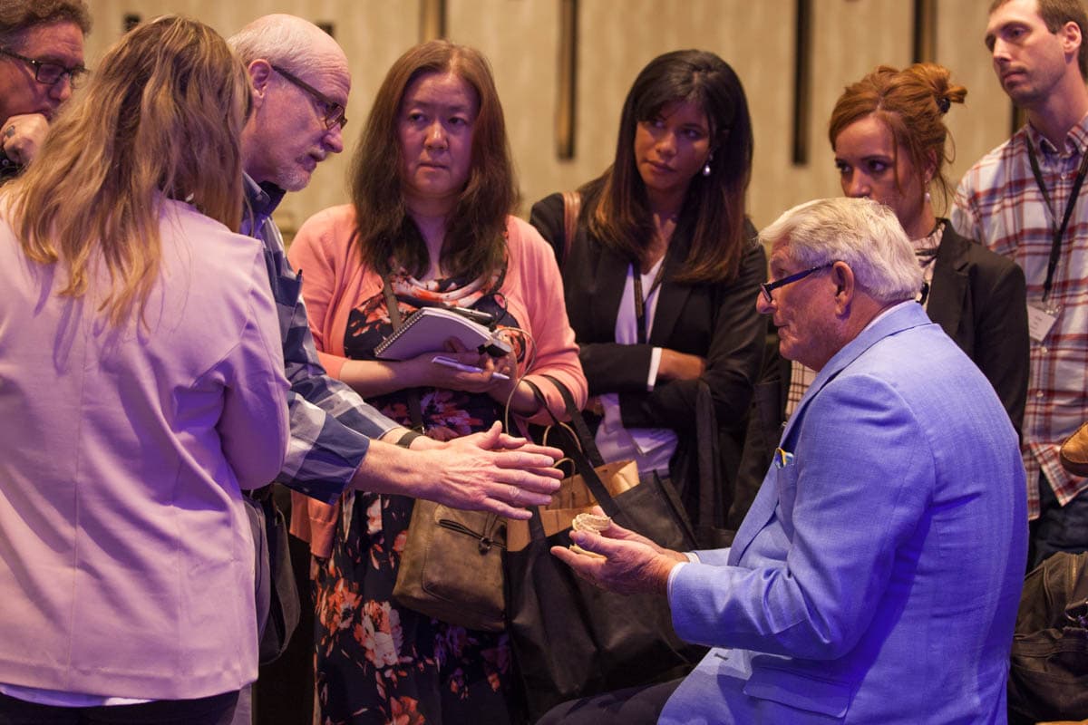 Attendees gathered around the doctors between sessions at the Simplifying Complex CE seminar